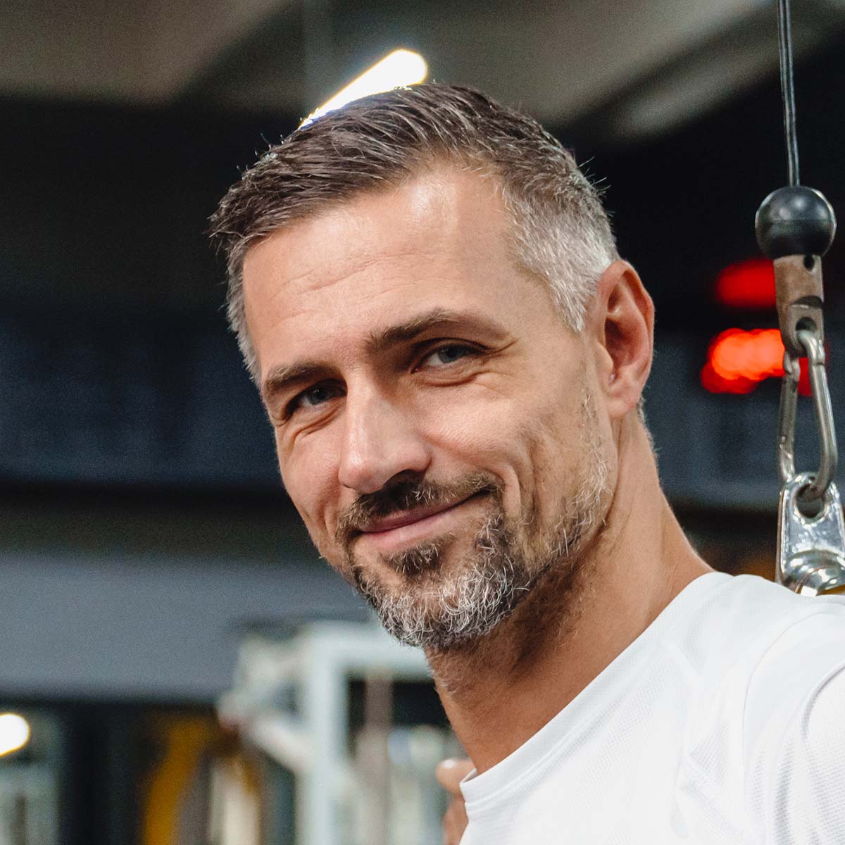 attractive healthy sports man in gym